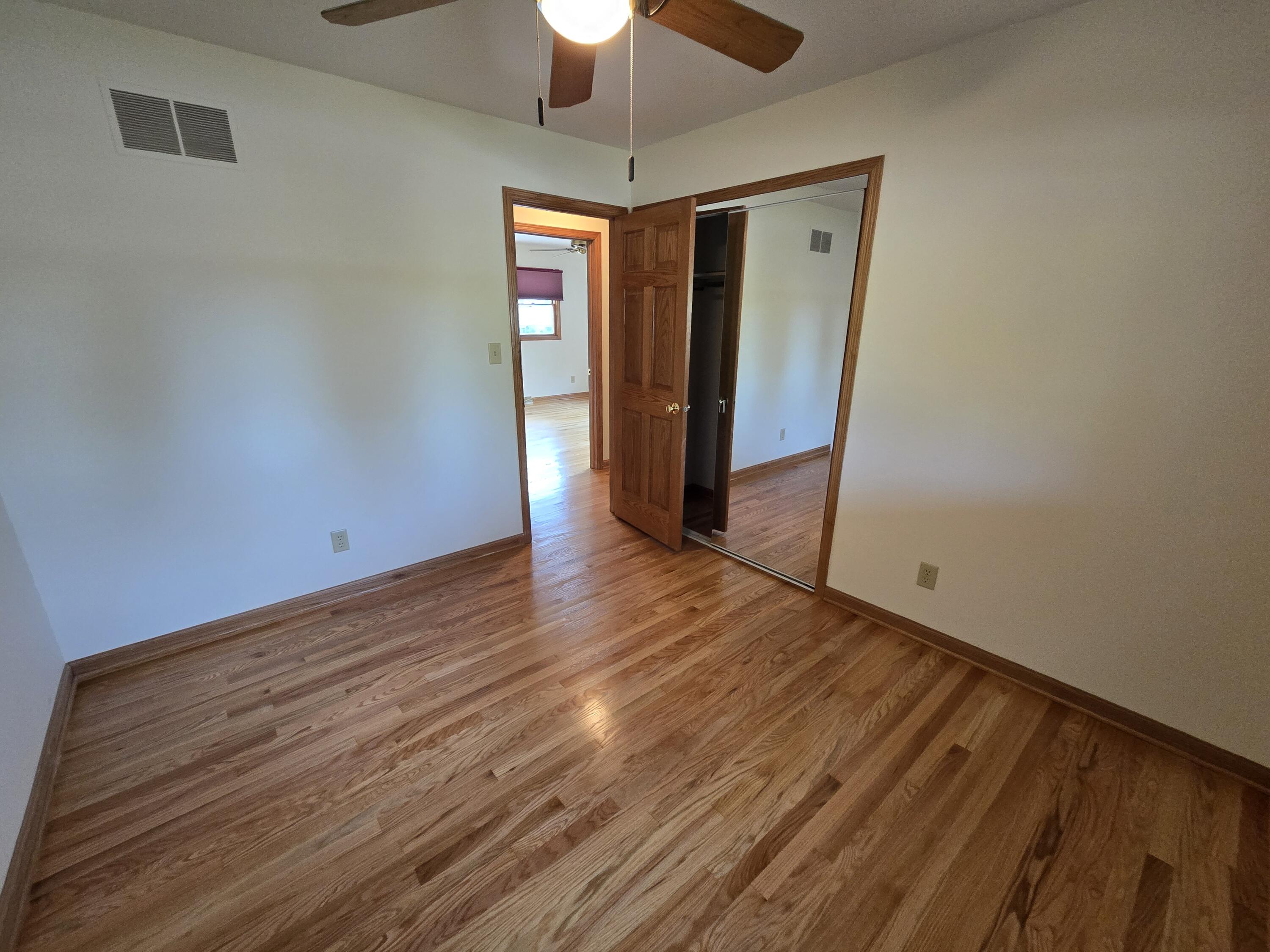 1828 Wren Drive Munster, IN 46321 - Photo 18 of 36 a view of hallway with wooden floor and chandelier