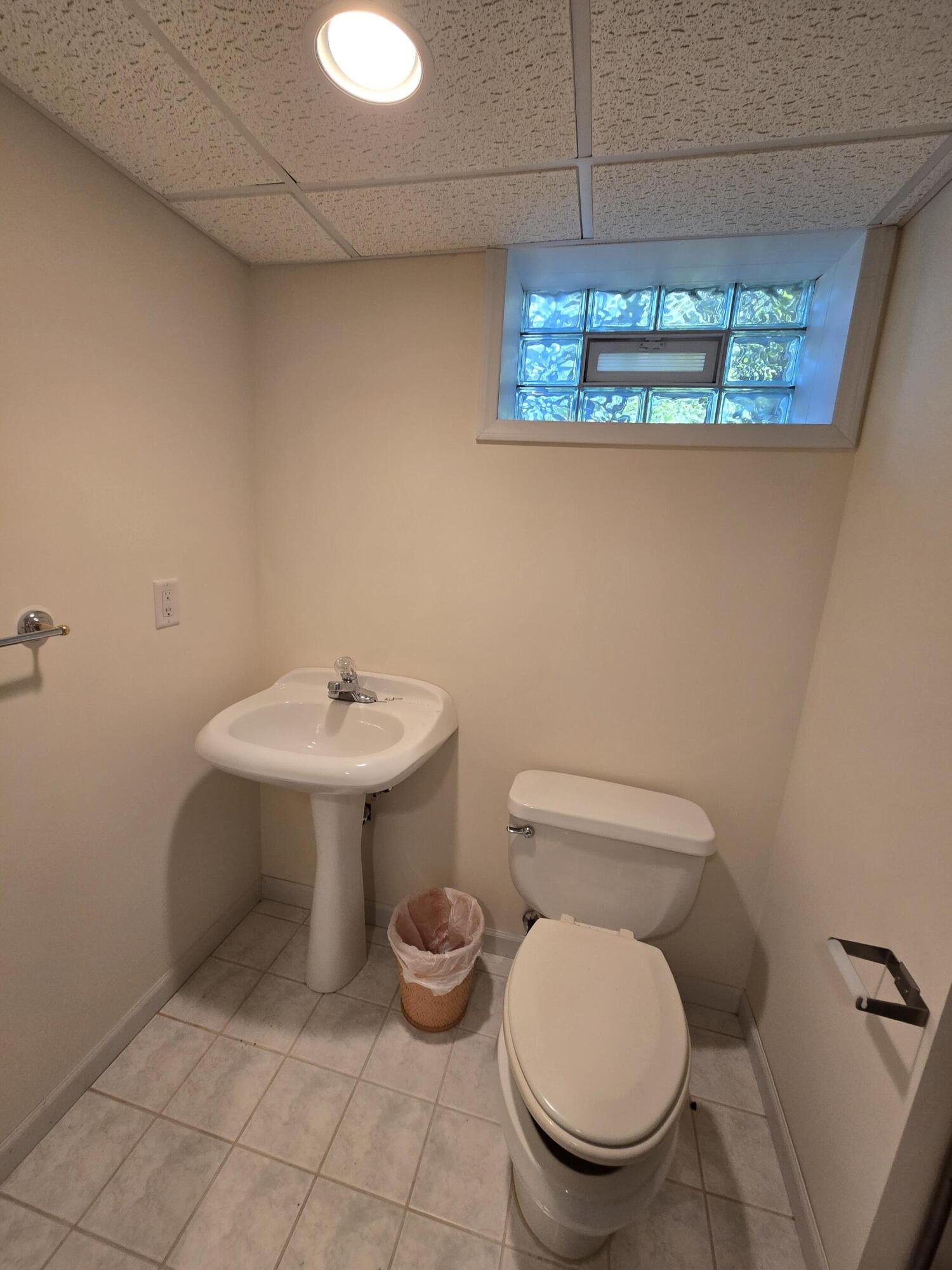 1828 Wren Drive Munster, IN 46321 - Photo 33 of 36 a bathroom with a toilet sink and mirror