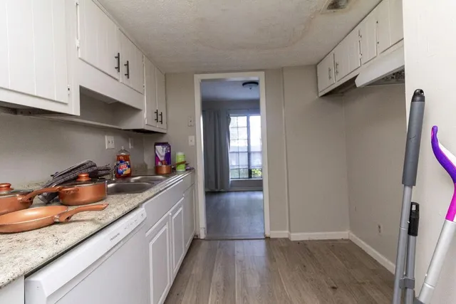 a kitchen with stainless steel appliances granite countertop a sink and cabinets