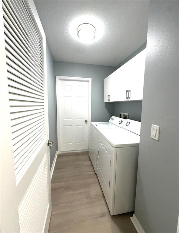 9706 Southwest 92nd Place Road Ocala, FL 34481 - Photo 24 of 82 a utility room with dryer and washer