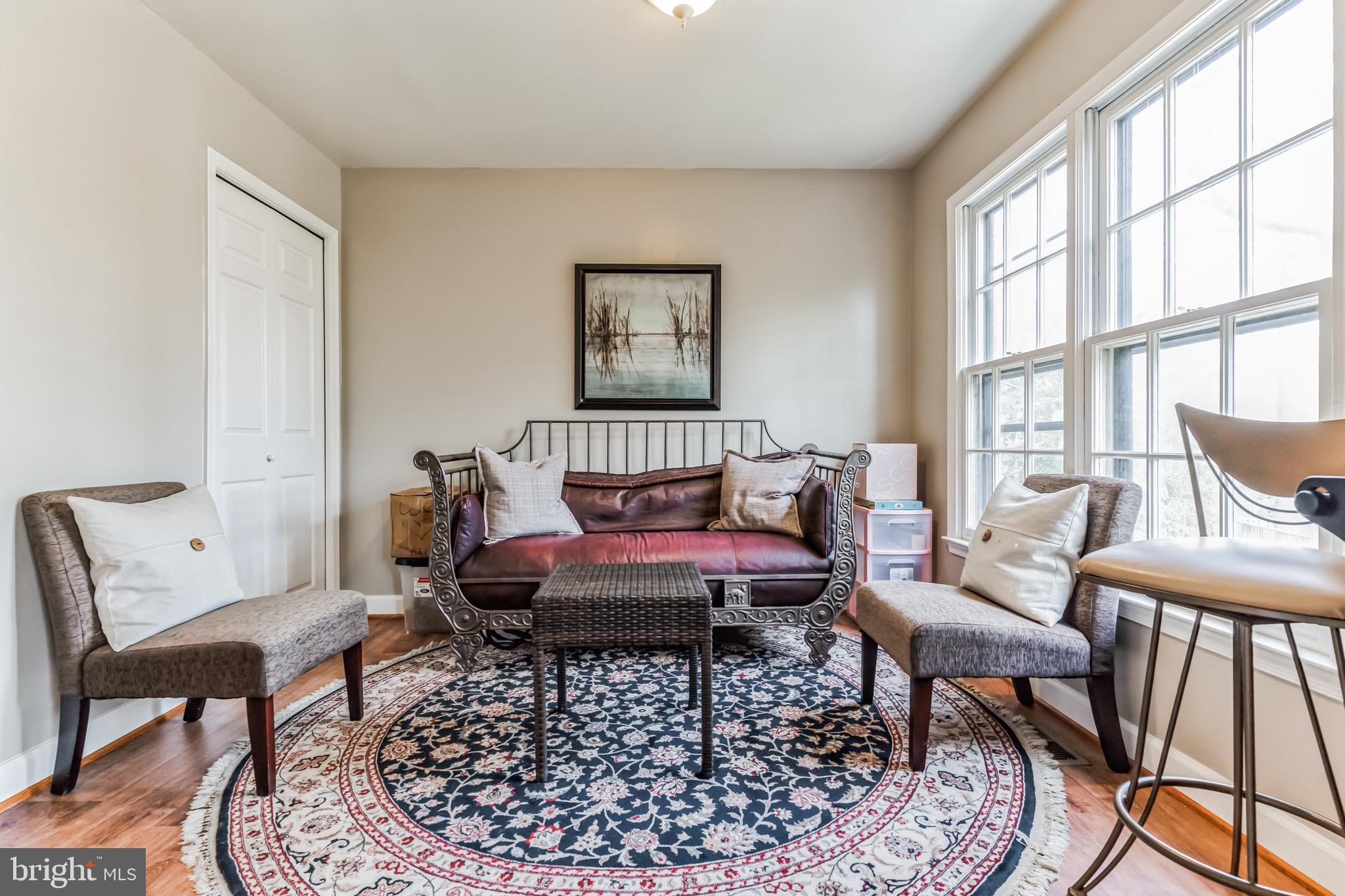 4926 Carriagepark Road Fairfax, VA 22032 - Photo 14 of 34 a living room with furniture and a window