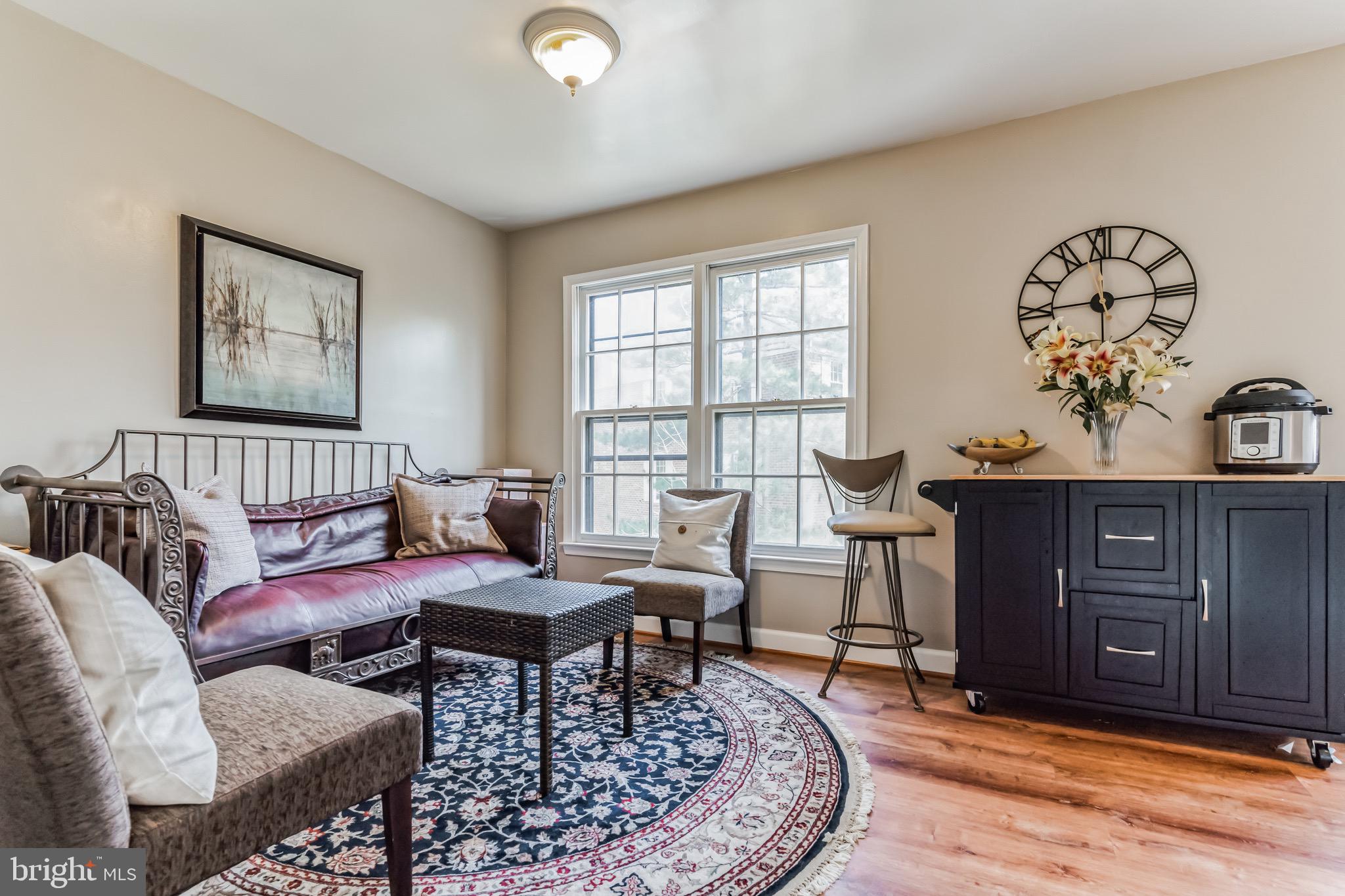 4926 Carriagepark Road Fairfax, VA 22032 - Photo 15 of 34 a living room with furniture and wooden floor