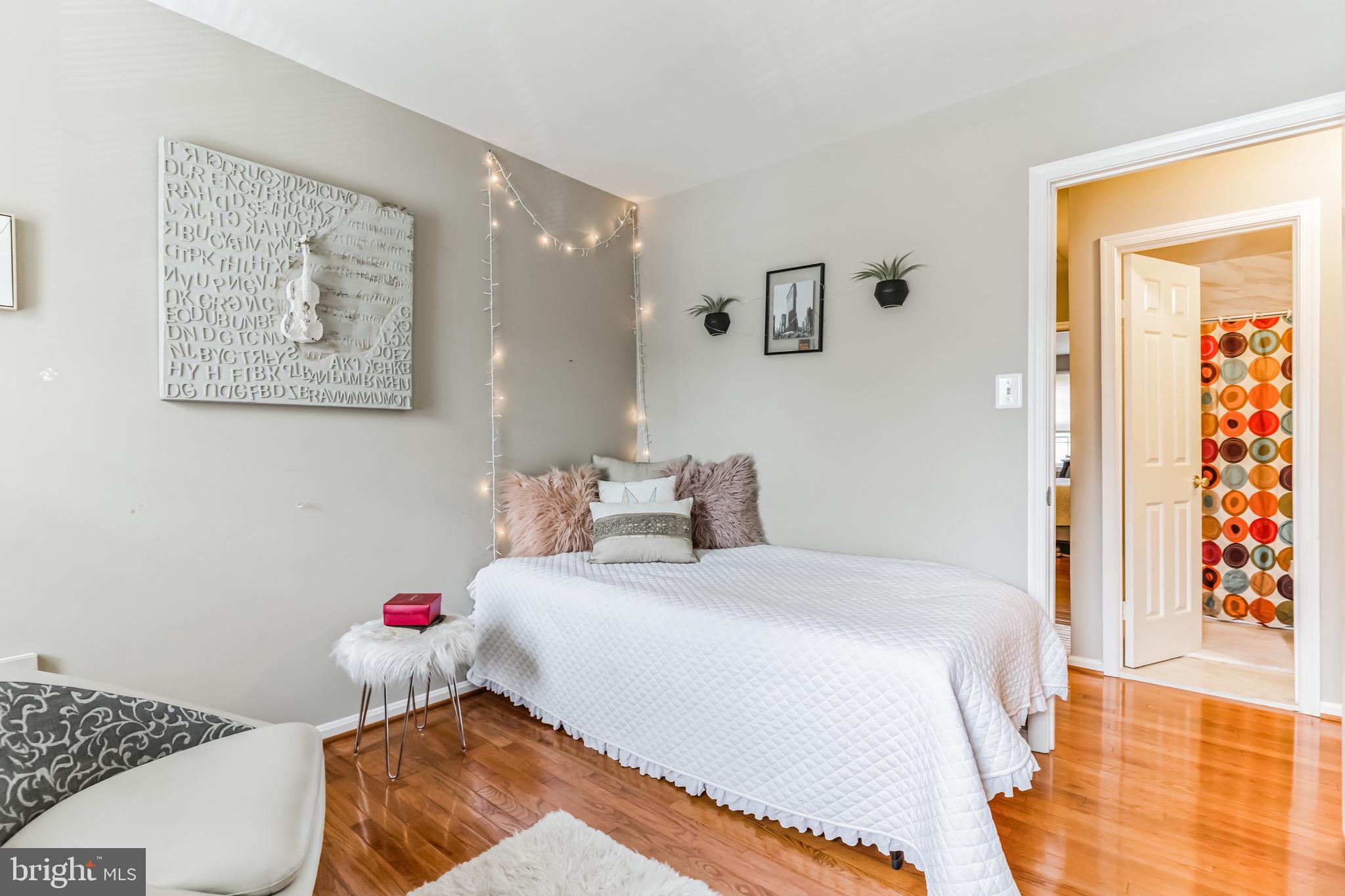 4926 Carriagepark Road Fairfax, VA 22032 - Photo 26 of 34 a bedroom with a bed and a cabinets