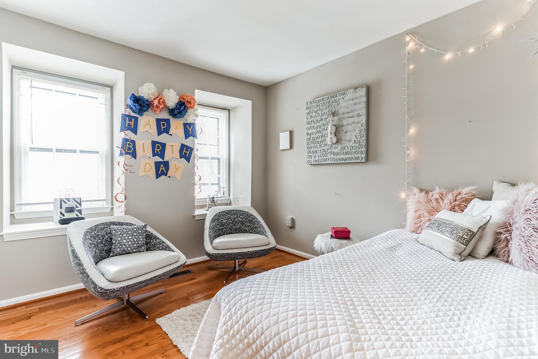 4926 Carriagepark Road Fairfax, VA 22032 - Photo 27 of 34 a bedroom with a bed and a couch