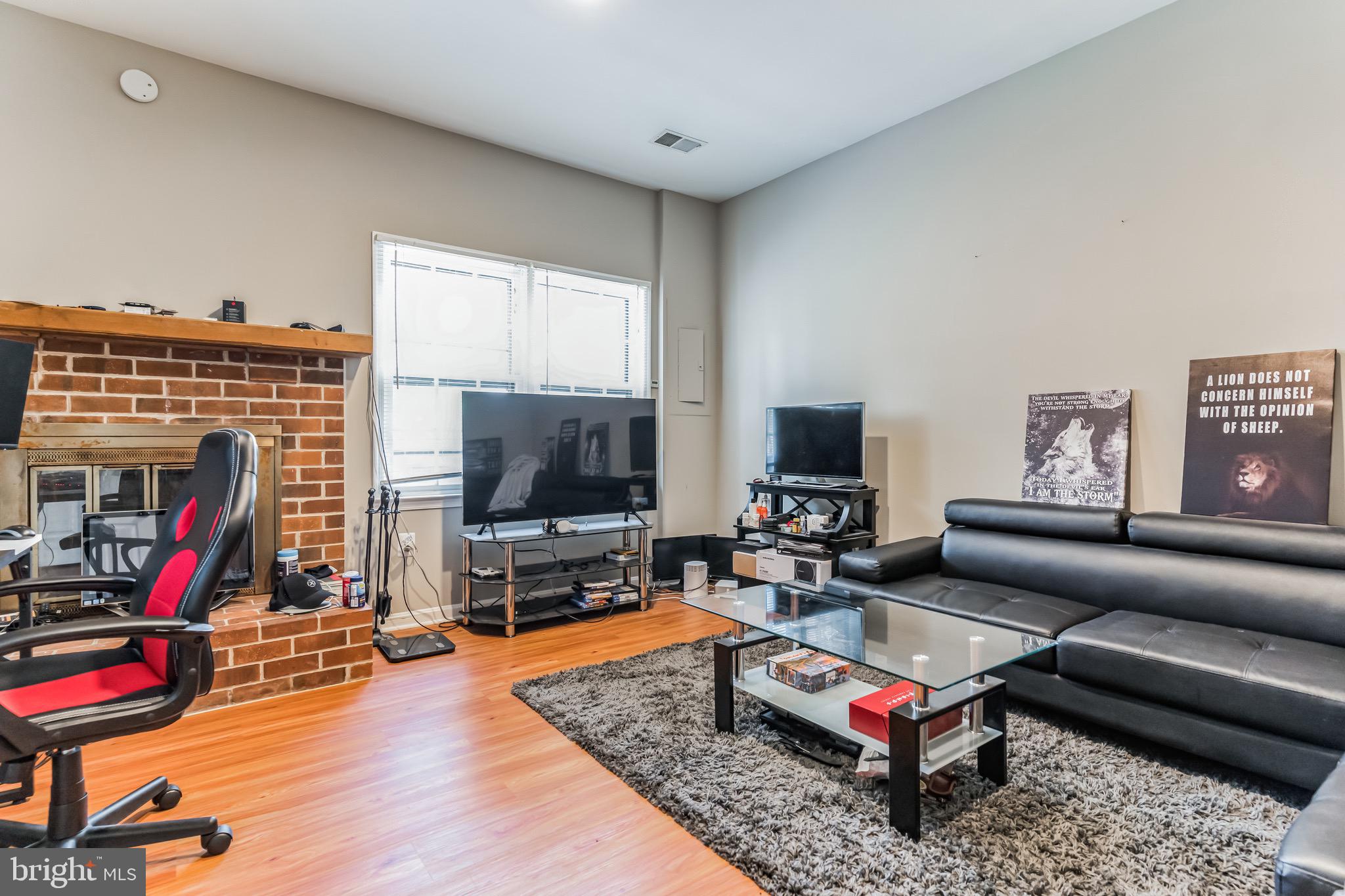 4926 Carriagepark Road Fairfax, VA 22032 - Photo 30 of 34 a living room with furniture and a flat screen tv