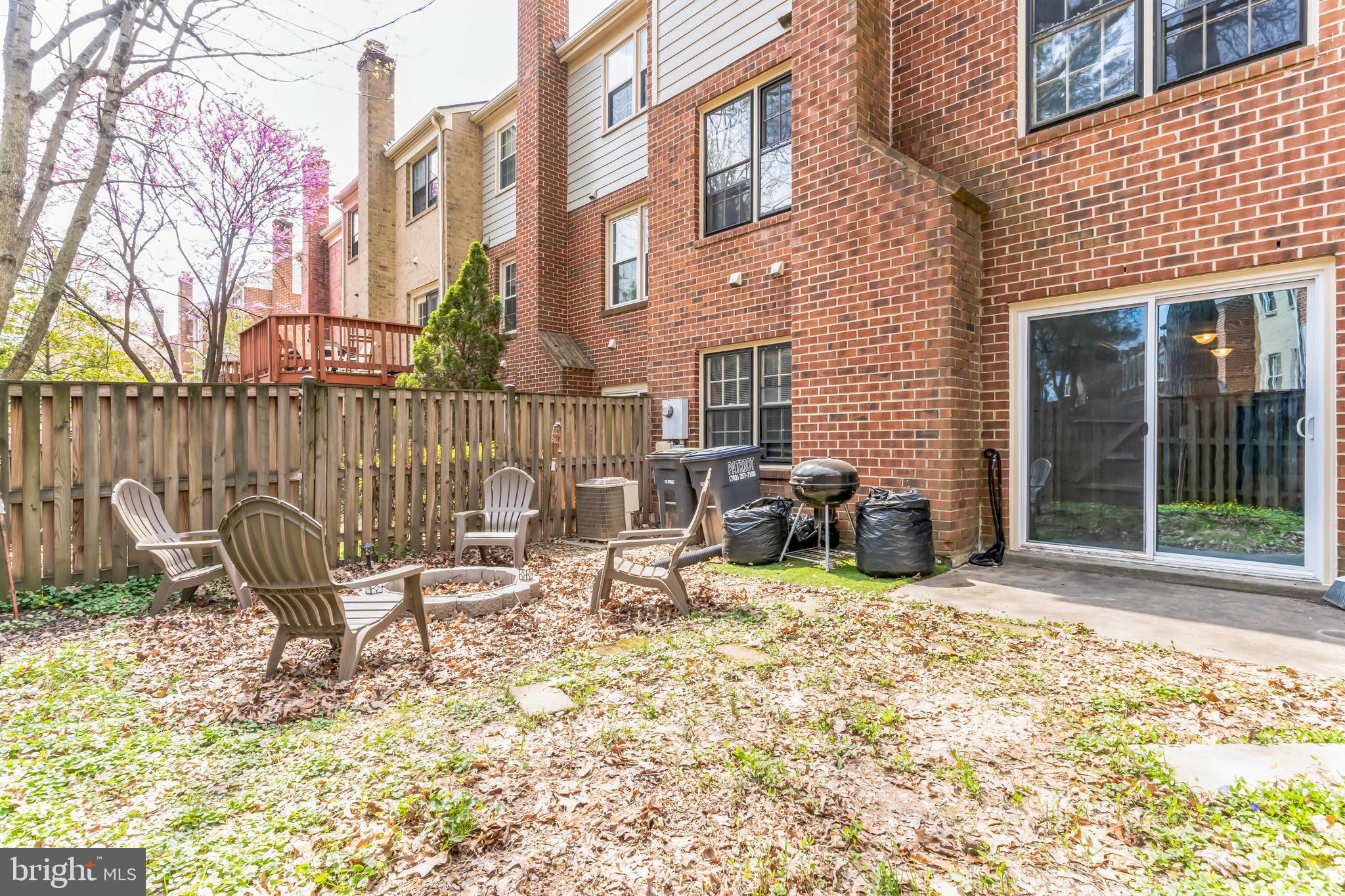 4926 Carriagepark Road Fairfax, VA 22032 - Photo 34 of 34 a view of a chair and tables in the patio area of the house