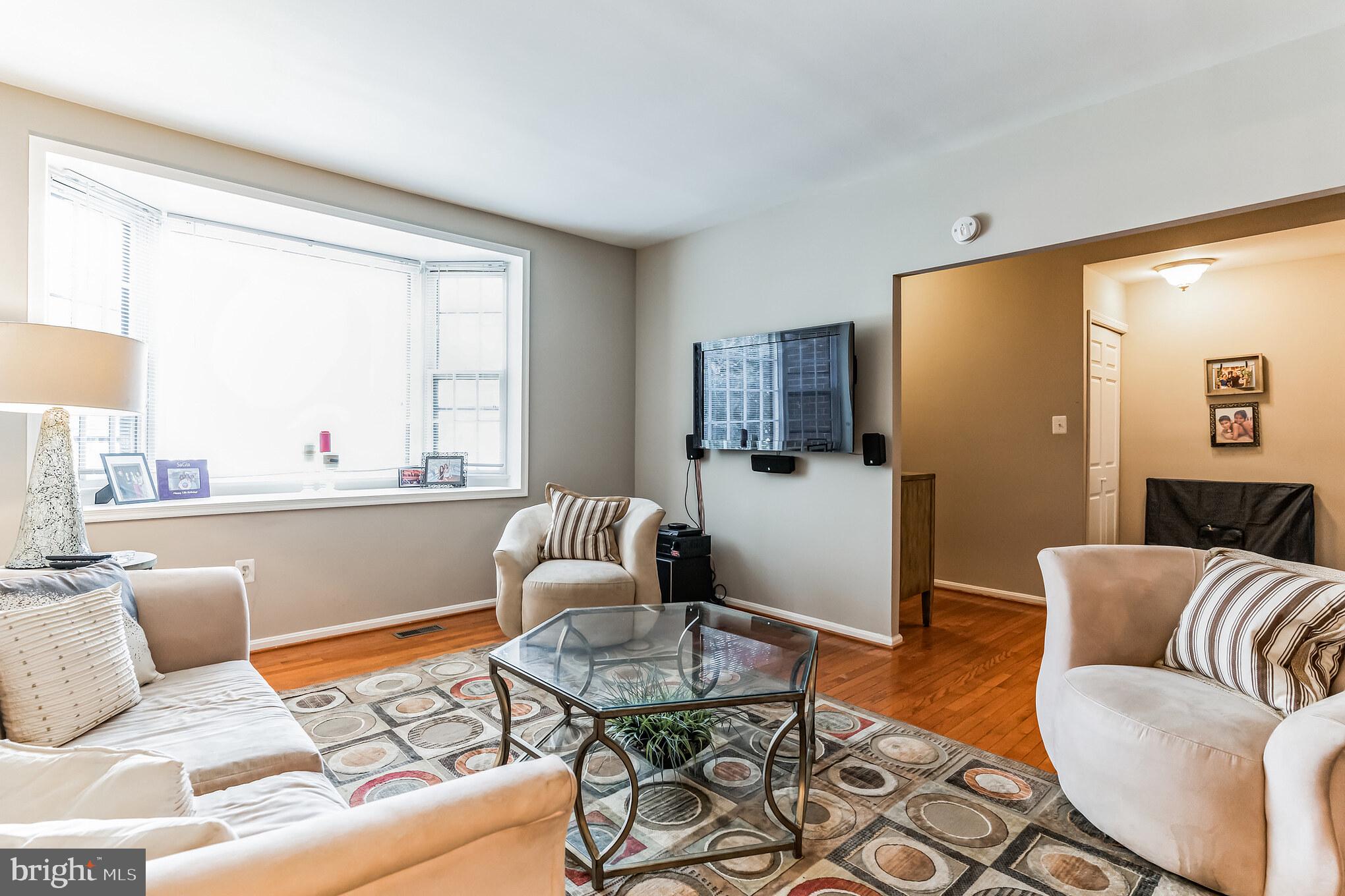 4926 Carriagepark Road Fairfax, VA 22032 - Photo 4 of 34 a living room with furniture and a large window