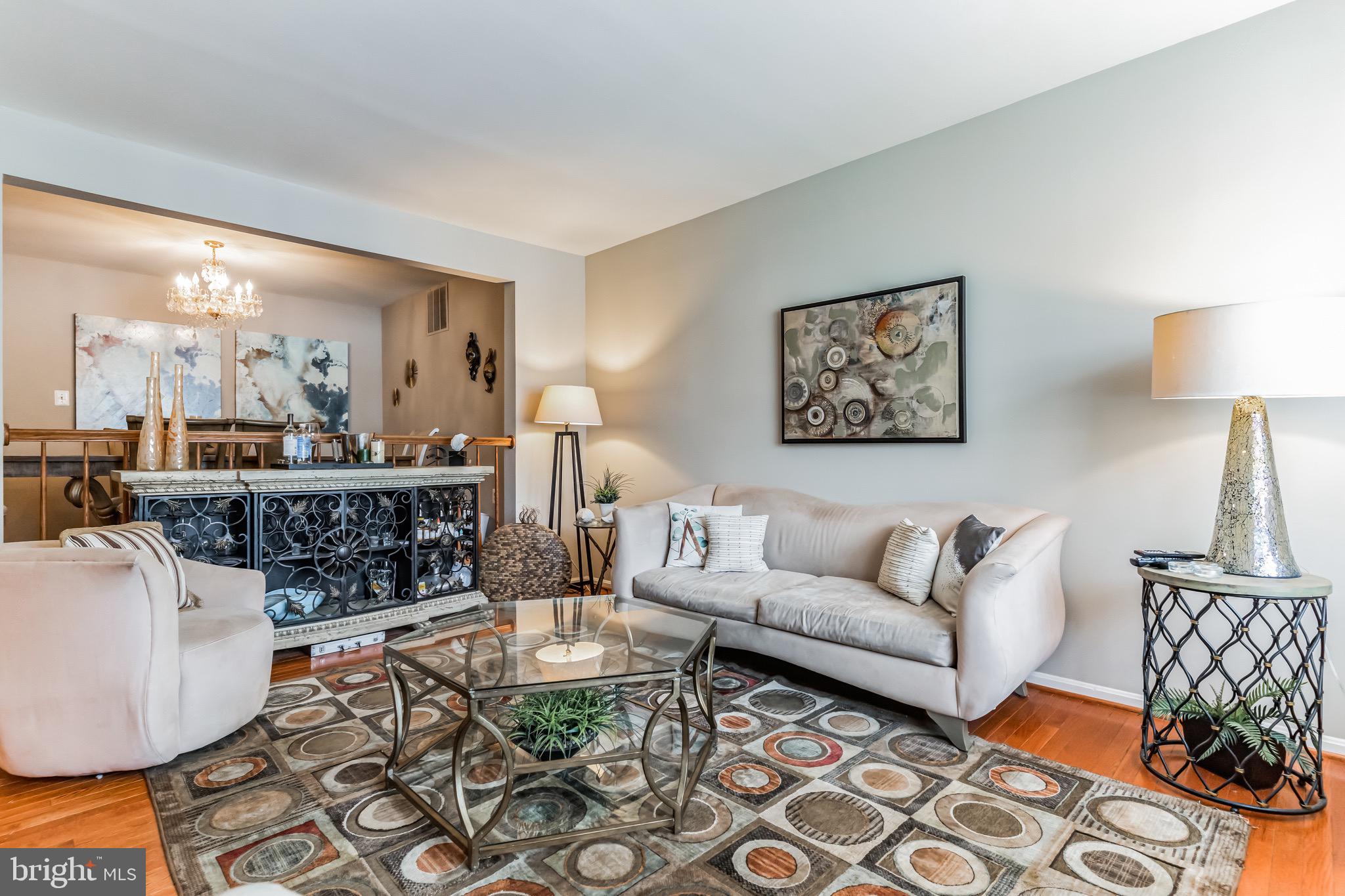 4926 Carriagepark Road Fairfax, VA 22032 - Photo 5 of 34 a living room with furniture a lamp and a large window