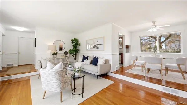a dining room with furniture and window
