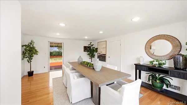 a living room with furniture rug and wooden floor
