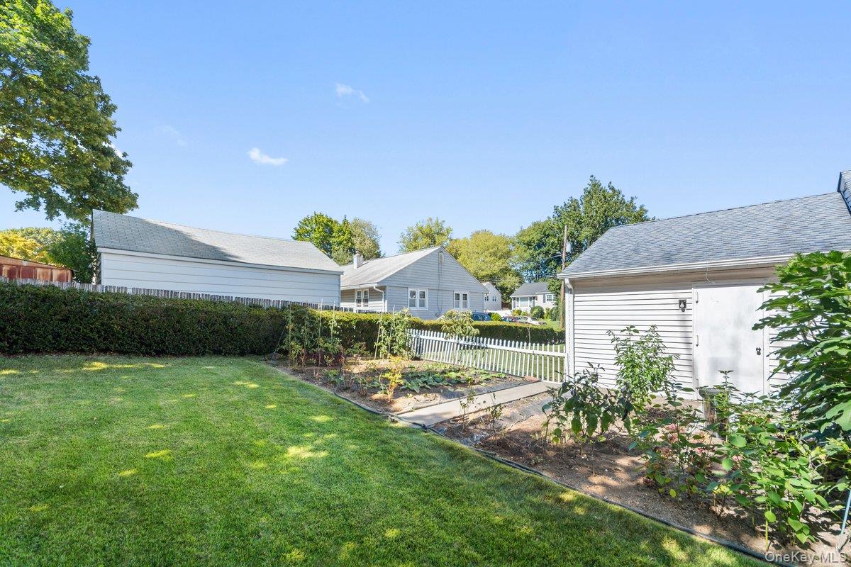 247 Croydon Road Yonkers, NY 10710 - Photo 6 of 27 View of yard with a vegetable garden and a residential view