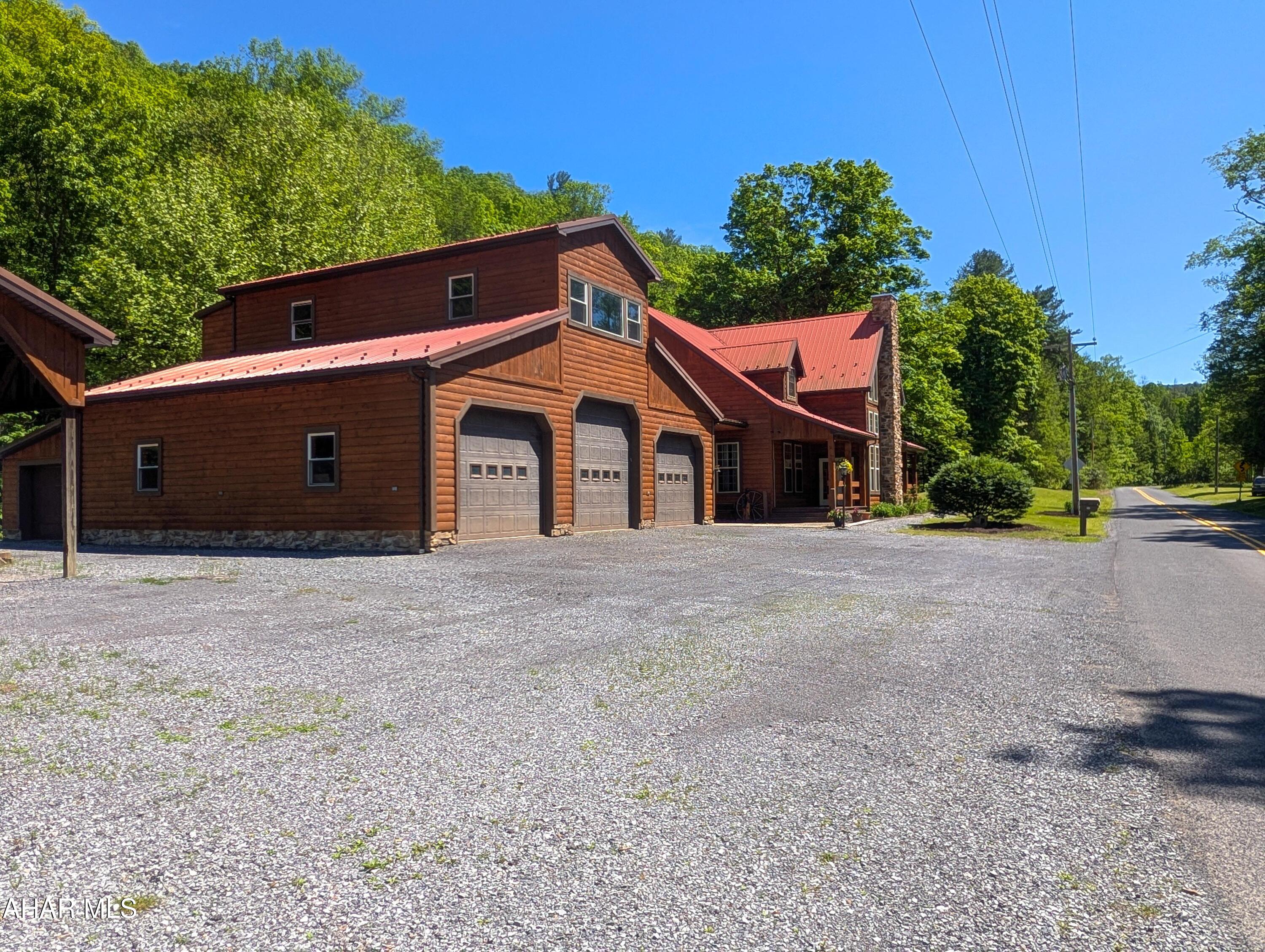 213 Sherman Valley Road Hopewell, PA 16650 - Photo 3 of 104 a front view of a house with a yard