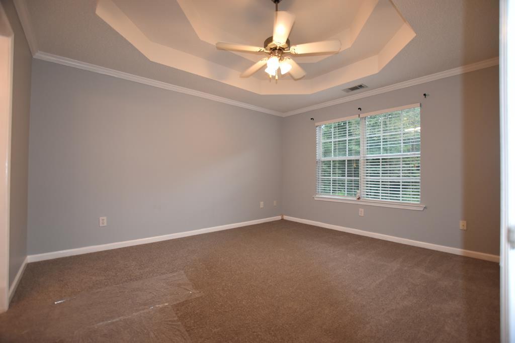3315 Trotter''s Ridge Trail Gray, GA 31032 - Photo 11 of 26 an empty room with windows and fan