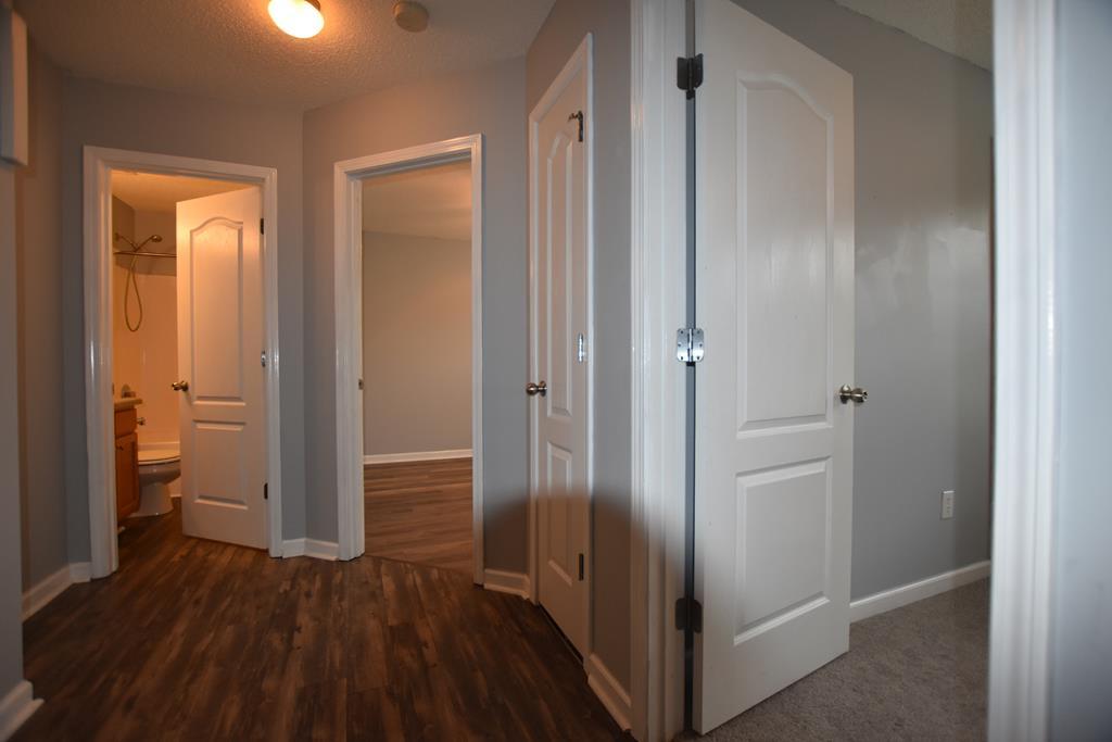 3315 Trotter''s Ridge Trail Gray, GA 31032 - Photo 13 of 26 a view of a hallway with wooden floor