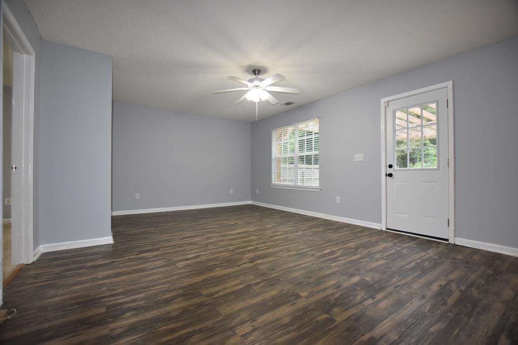 3315 Trotter''s Ridge Trail Gray, GA 31032 - Photo 17 of 26 wooden floor in an empty room with a window