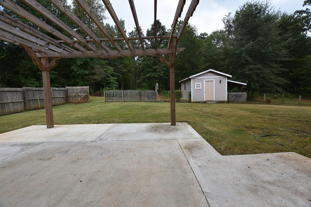 3315 Trotter''s Ridge Trail Gray, GA 31032 - Photo 22 of 26 a view of a house with a yard and large trees