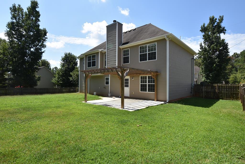 3315 Trotter''s Ridge Trail Gray, GA 31032 - Photo 24 of 26 a view of an house with backyard and a tree
