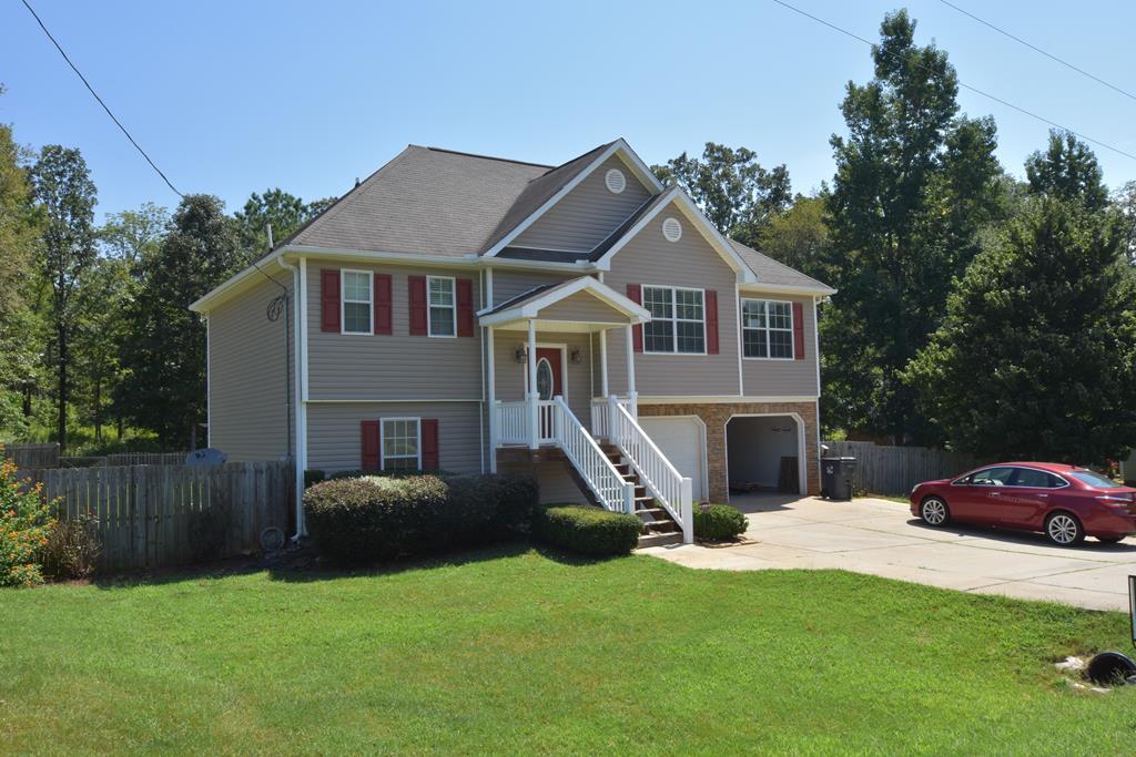 3315 Trotter''s Ridge Trail Gray, GA 31032 - Photo 25 of 26 a front view of a house with a yard and garage