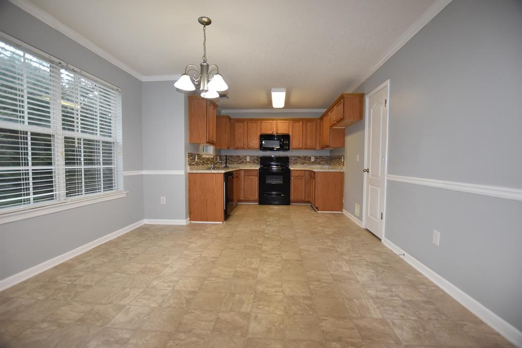 3315 Trotter''s Ridge Trail Gray, GA 31032 - Photo 4 of 26 a view of a kitchen with a stove cabinets and a kitchen