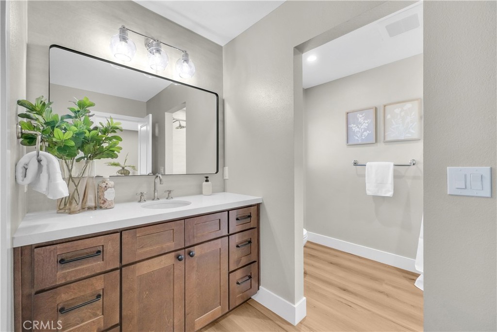 273 St Crispen Avenue Brea, CA 92821 - Photo 17 of 28 a bathroom with a granite countertop sink a mirror and a