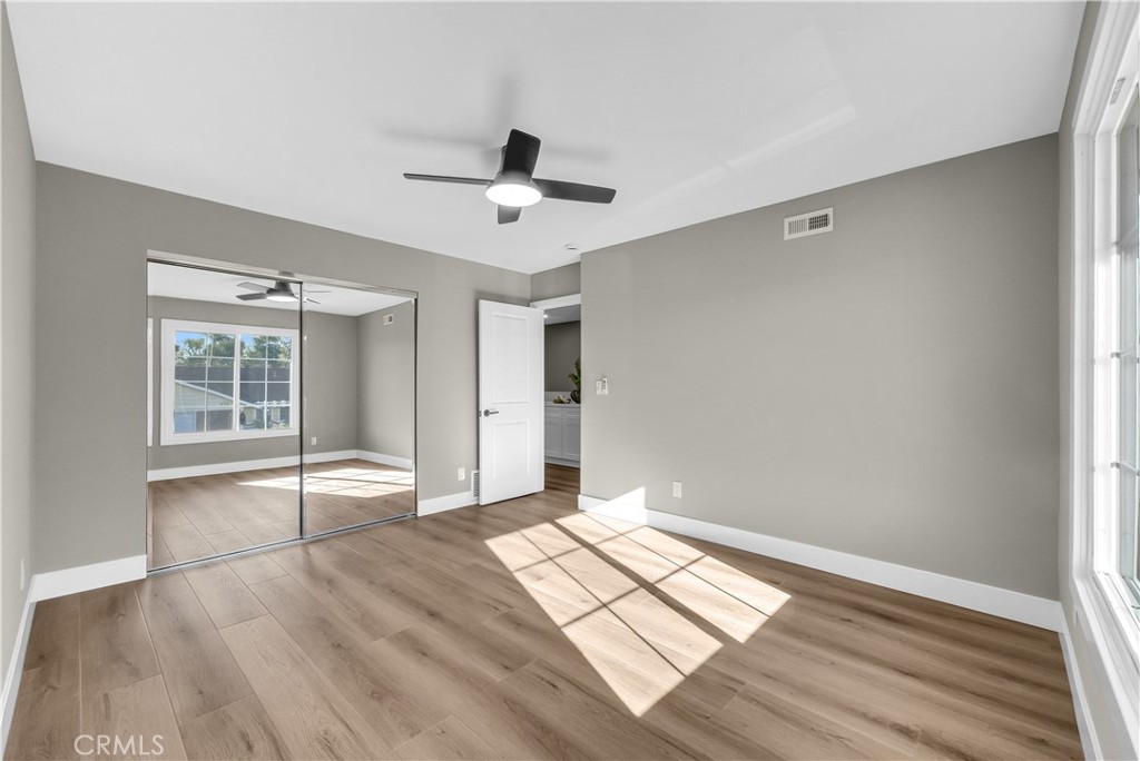 273 St Crispen Avenue Brea, CA 92821 - Photo 22 of 28 a view of empty room with wooden floor and fan
