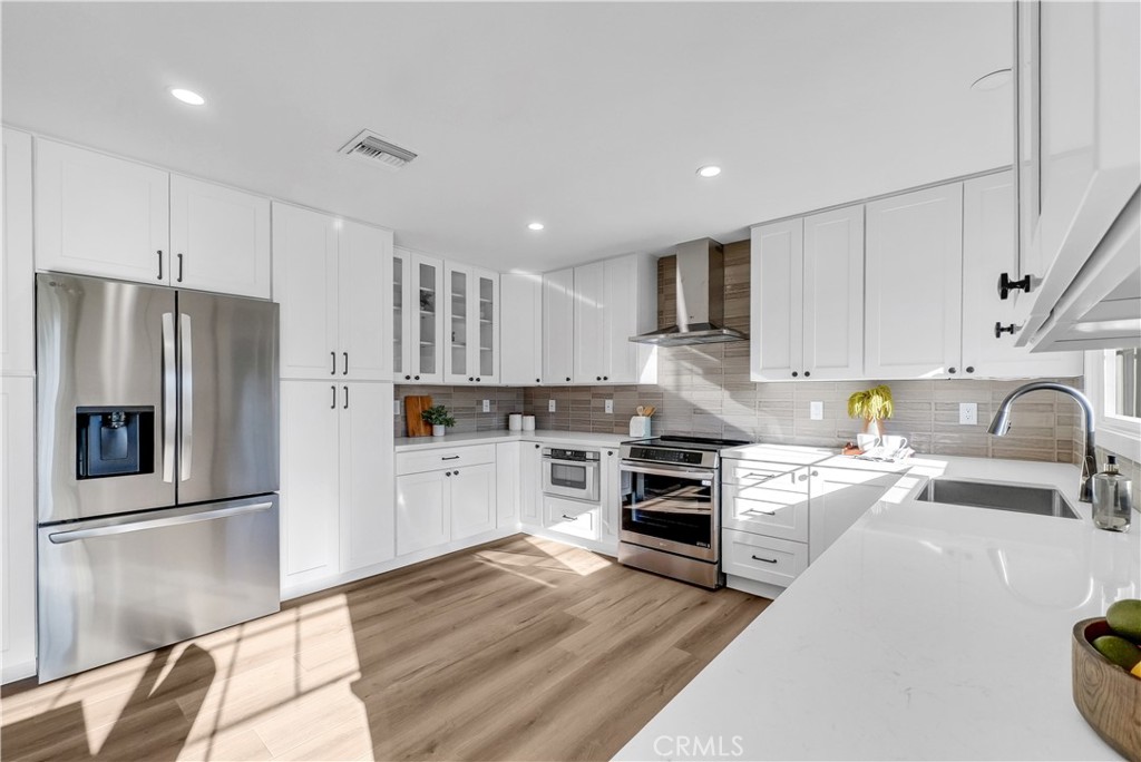 273 St Crispen Avenue Brea, CA 92821 - Photo 6 of 28 a kitchen with a refrigerator stove and sink