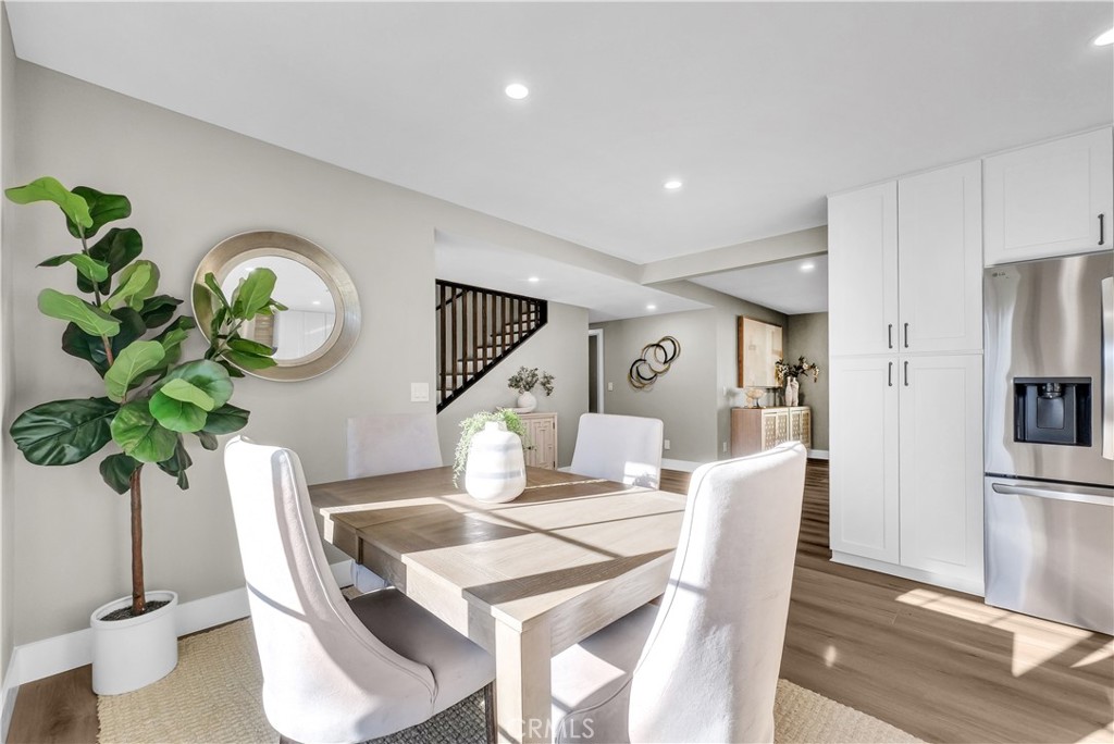 273 St Crispen Avenue Brea, CA 92821 - Photo 9 of 28 a dining room with furniture potted plants and wooden floor