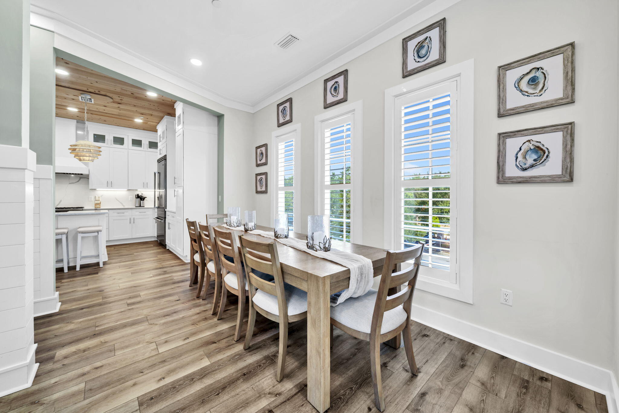 413 Henderson Cottage Way Destin, FL 32541 - Photo 13 of 70 a view of a dining room with furniture and wooden floor
