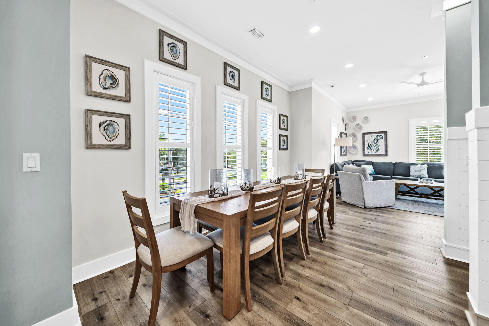 413 Henderson Cottage Way Destin, FL 32541 - Photo 14 of 70 a view of a dining room with furniture and wooden floor