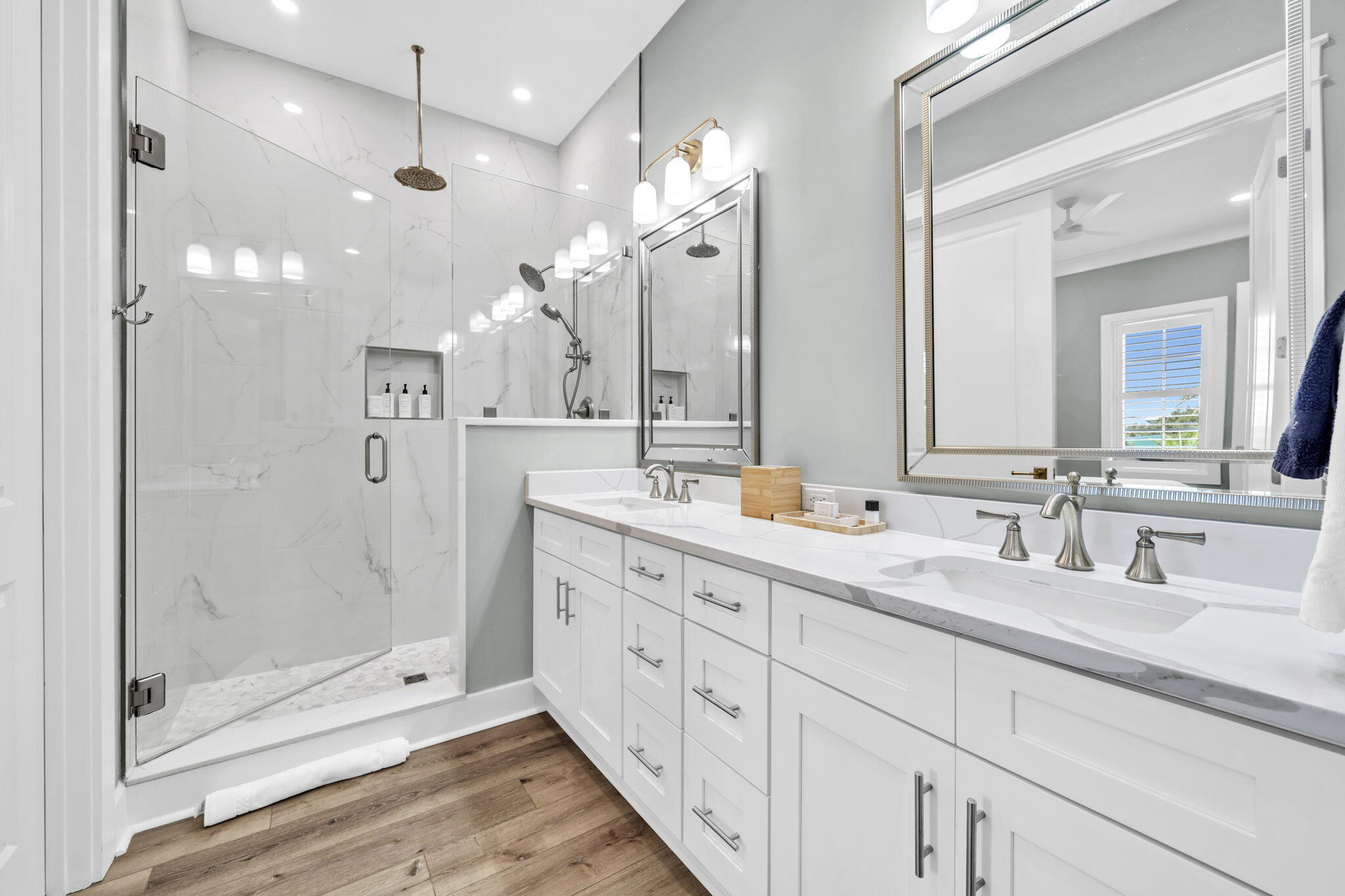 413 Henderson Cottage Way Destin, FL 32541 - Photo 19 of 70 a bathroom with a double vanity sink mirror and shower