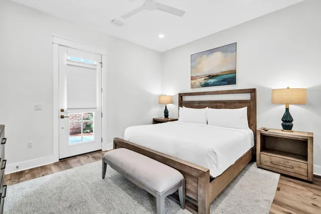 a bedroom with a bed and a night stand