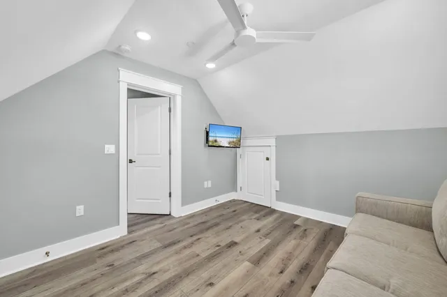 a front view of a residential apartment building with a yard