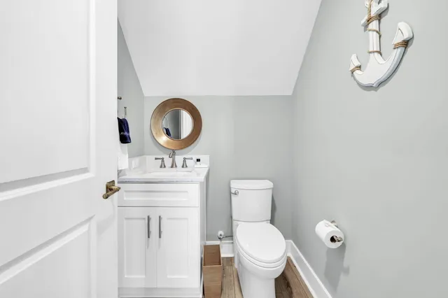 a front view of a residential apartment building with a yard