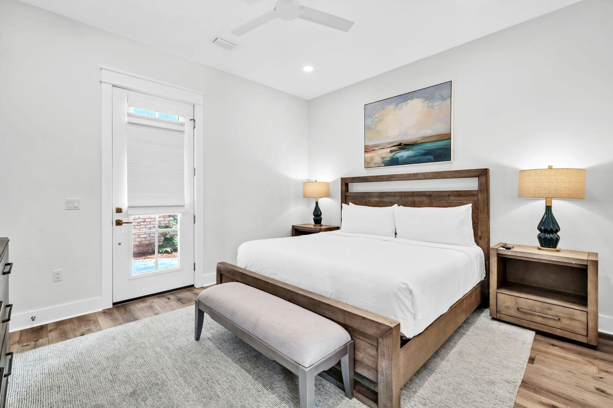 413 Henderson Cottage Way Destin, FL 32541 - Photo 32 of 70 a bedroom with a bed and a night stand