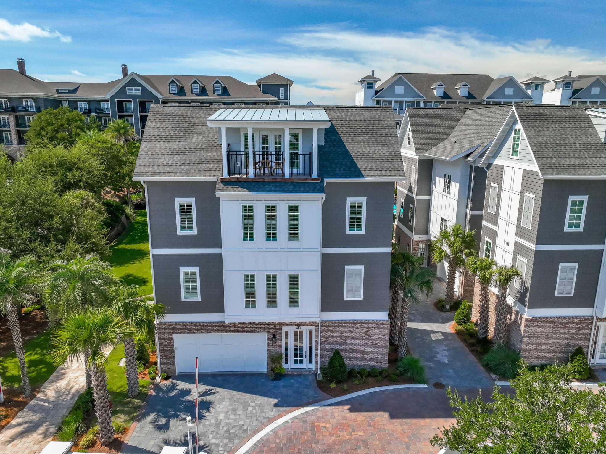 413 Henderson Cottage Way Destin, FL 32541 - Photo 69 of 70 a front view of a residential apartment building with a yard