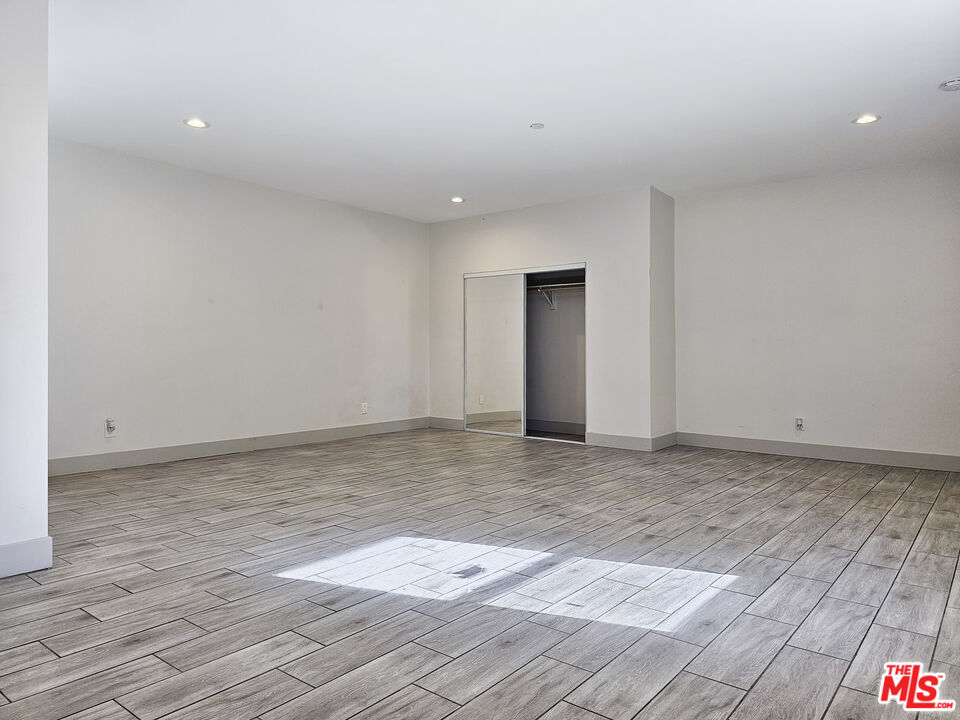 38580 Rancho Los Cerritos Drive, Unit S2 Indio, CA 92203 - Photo 12 of 44 a view of an empty room and wooden floor