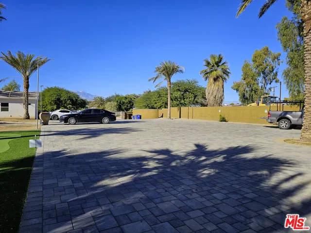 a view of a car parked in front of a house