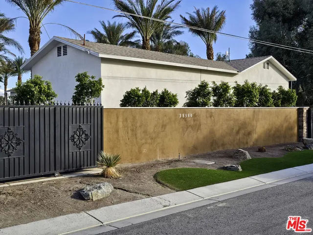 a view of front door and potted plants