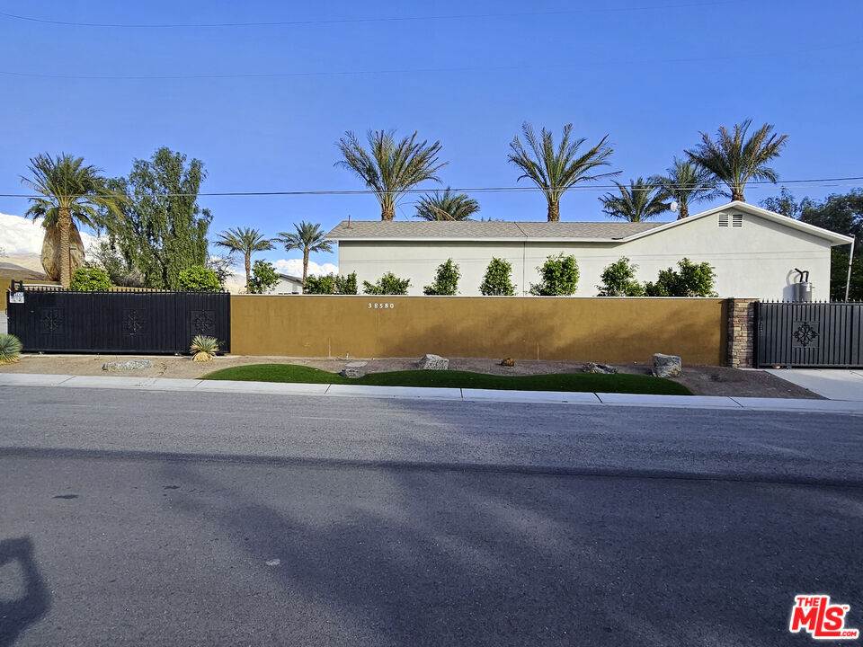38580 Rancho Los Cerritos Drive, Unit S2 Indio, CA 92203 - Photo 29 of 44 front view of a house with a street