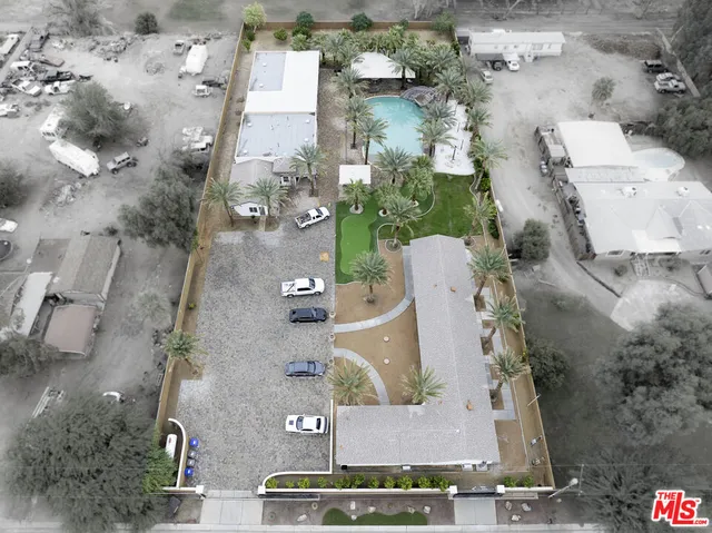 an aerial view of a house with outdoor space