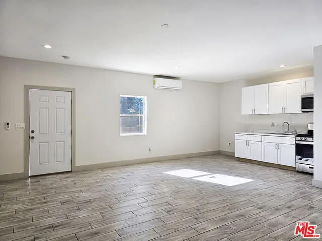 a view of kitchen with wooden floor