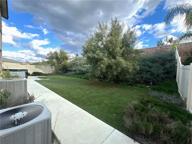 a view of a backyard with a lake view