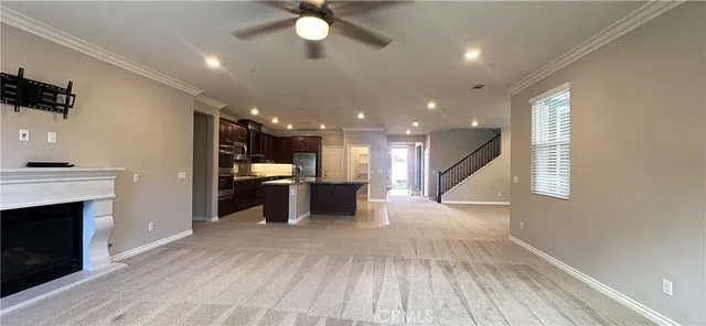 a view of a kitchen with a sink and a fireplace