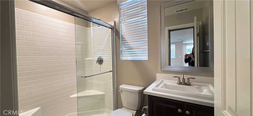 33833 Edge Temecula, CA 92592 - Photo 9 of 18 a bathroom with a sink a toilet and shower