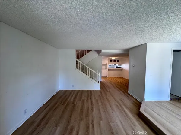 a view of hallway with wooden floor