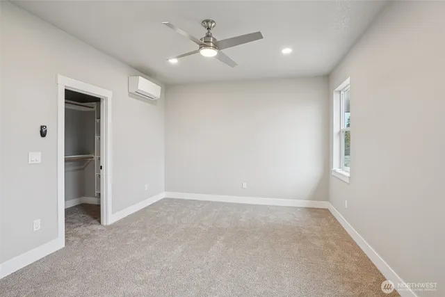 a bathroom with a tub sink toilet and a mirror