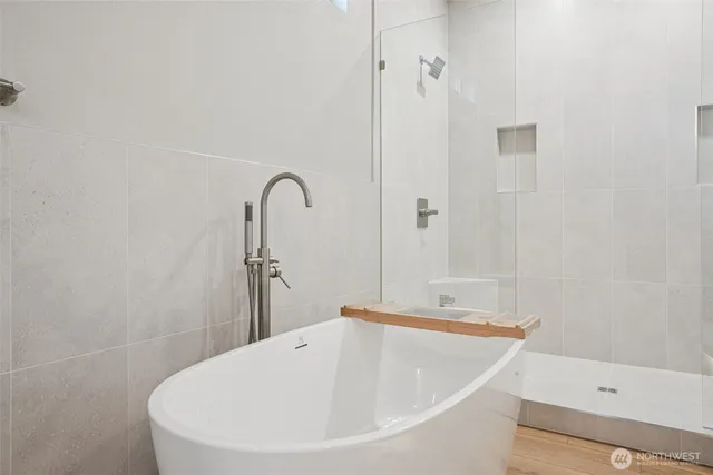 a bathroom with a bathtub and a sink