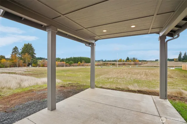 a view of a house with a backyard and a yard