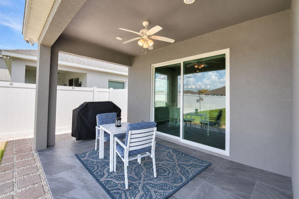 4340 Reding Way Lakeland, FL 33813 - Photo 52 of 63 a dining room with furniture and a fireplace