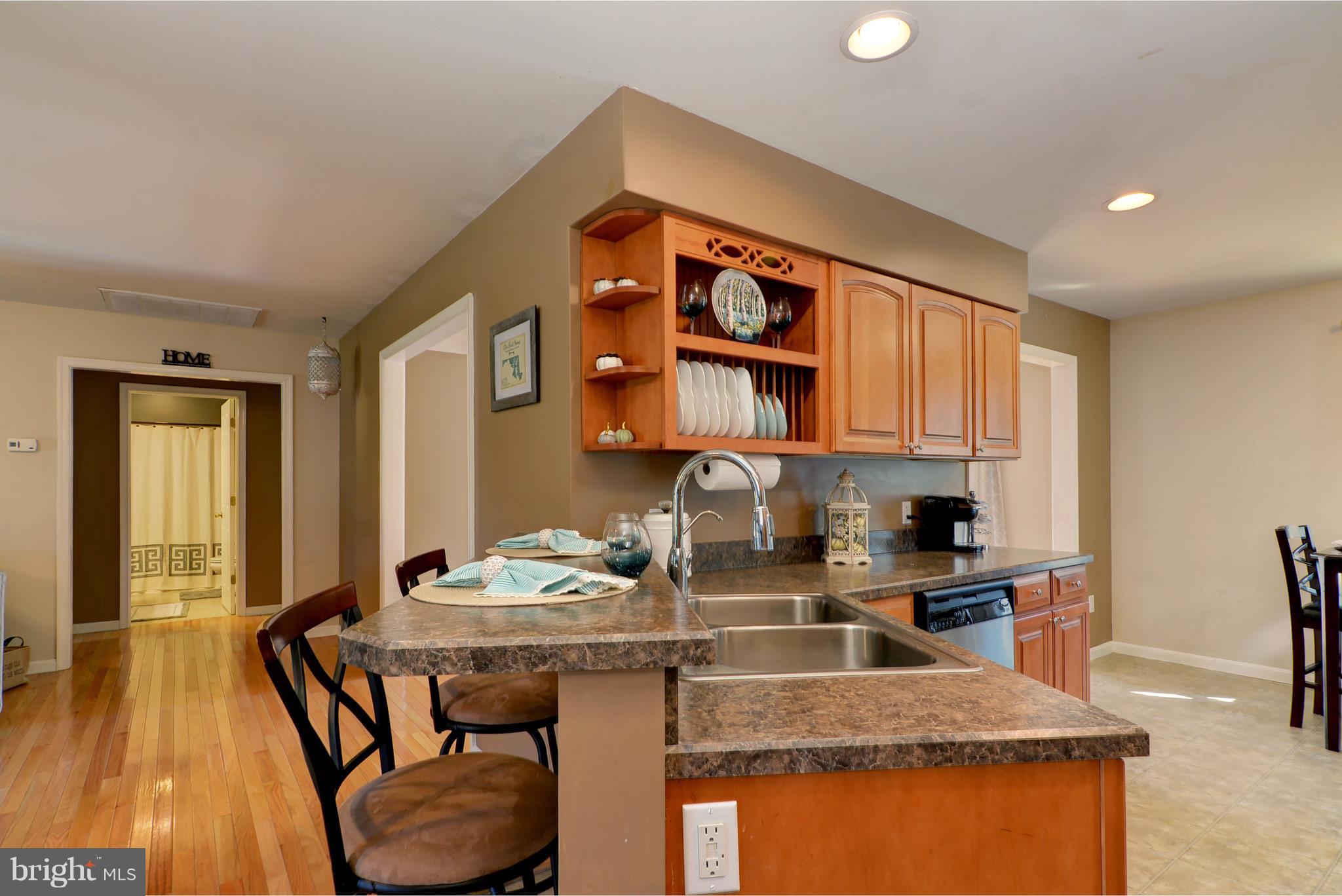 6025 Cokesbury Road Rhodesdale, MD 21659 - Photo 7 of 35 Kitchen breakfast bar to hallway
